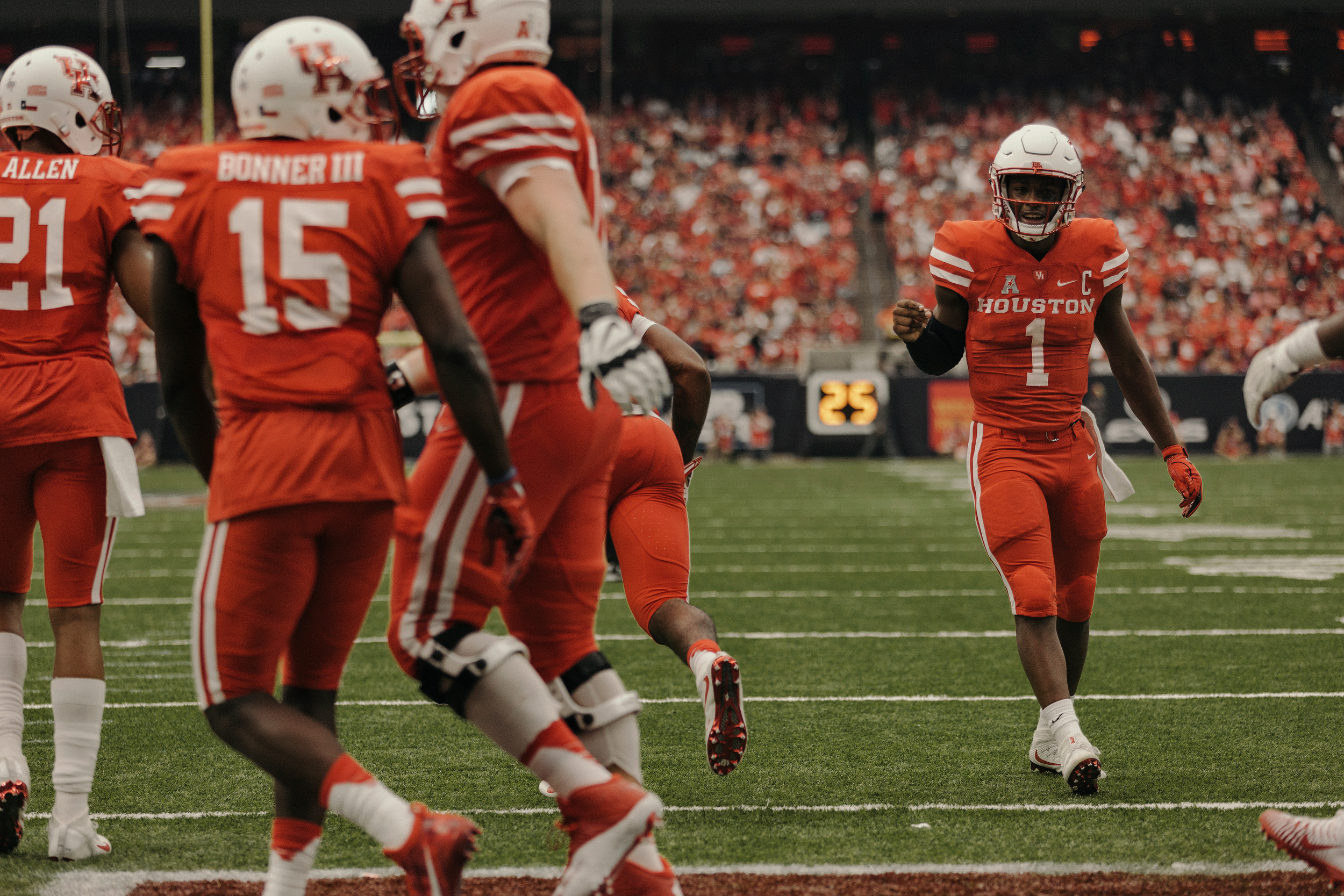 University of Houston quarterback, Greg Ward Jr., Celebrates an early touchdown with his teammates. Todd Spoth for The New York Times.