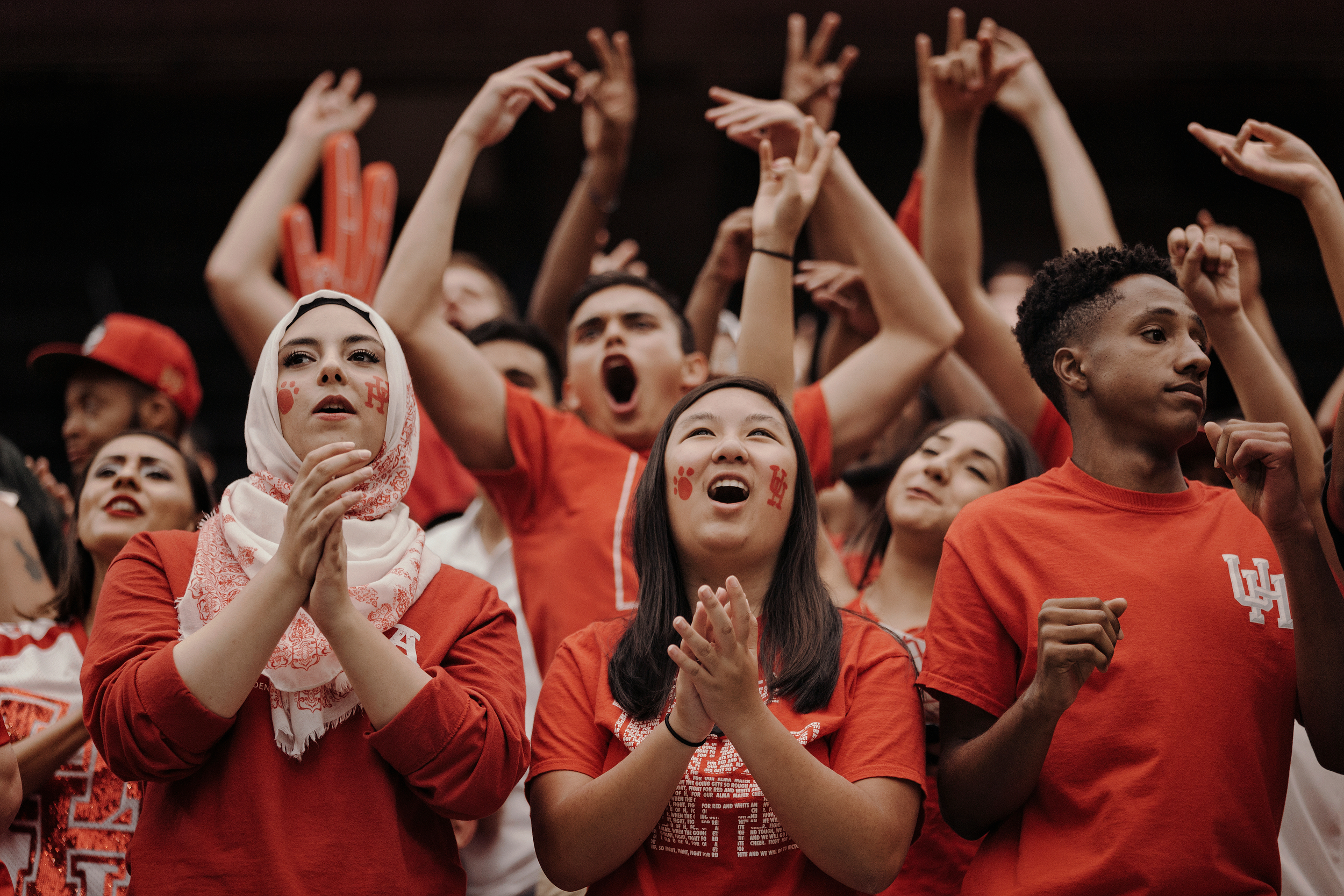 University of Houston fans cheer on their team from the sidelines. Todd Spoth for The New York Times.