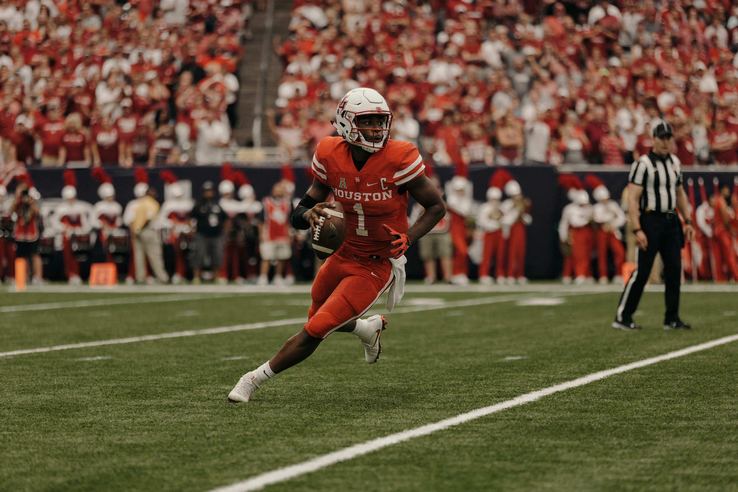 University of Houston quarterback, Greg Ward Jr., scrambles out of the pocket during the first half. Todd Spoth for The New York Times.